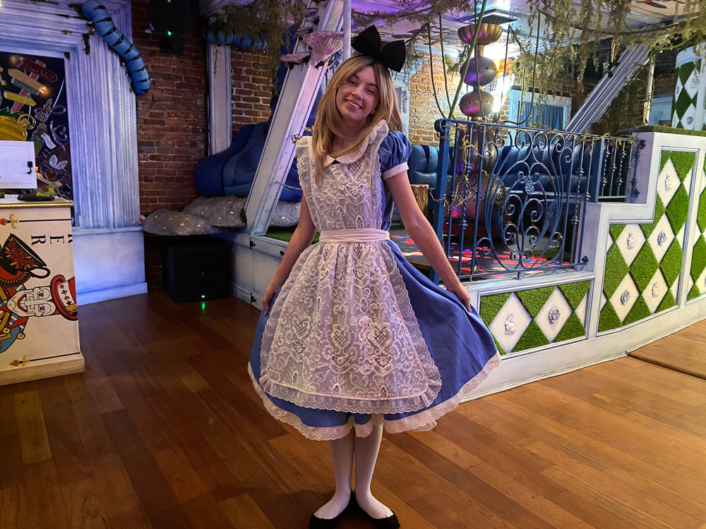 alice in wonderland with blue dress and white apron